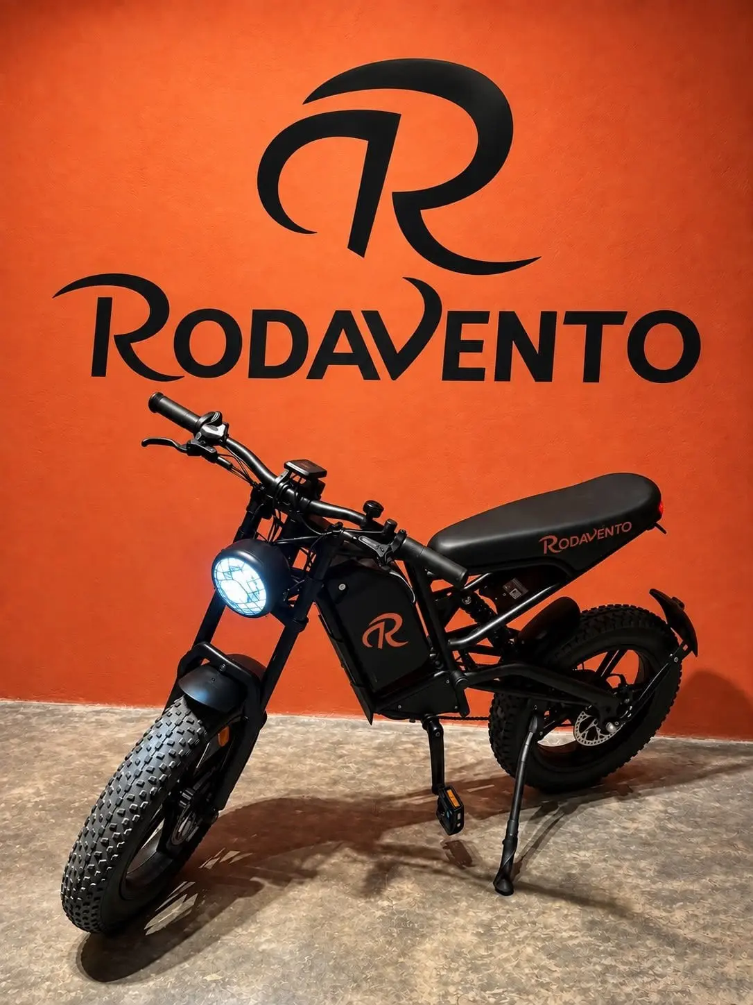 Black RV Max electric bike on the orange wall of the Rodavento store